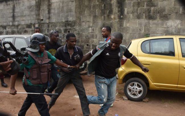 A man being arrested by Task Force officials